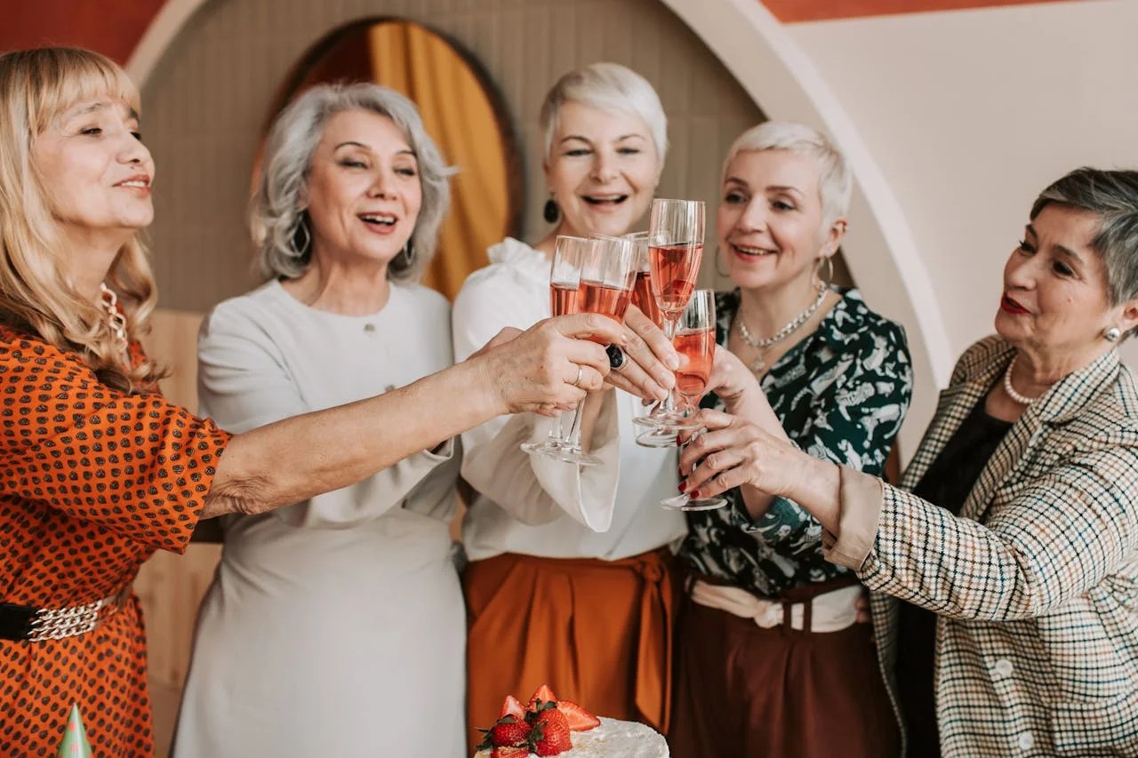 Photo by Vlada Karpovich: https://www.pexels.com/photo/a-group-of-elderly-women-clinking-glasses-7561105/